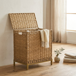 Tall <b>rectangular</b> woven <b>basket</b> laundry <b>basket</b> with an attached hinged lid and a gold-toned metal stand, available at wholesale. - Product Image 1