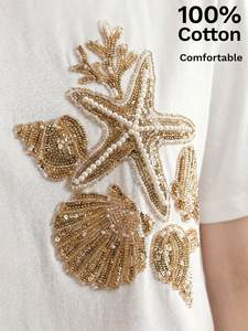 Camiseta Artesanal con Cuentas y Bordado de Estrella de Mar y Conchas Doradas en Algodón - Product Image 1