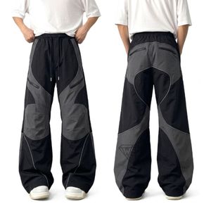Pantalon de survêtement contemporain pour homme avec surpiqûres contrastées, coupe oversize, jambe large, style décontracté urbain, taille élastique, idéal pour la détente - Product Image 4
