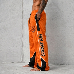 Pantalon de survêtement coupe-vent pour homme, bas de tenue haute performance conçu avec un matériau léger et à séchage rapide pour l'exercice et la course à pied - Product Image 4