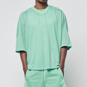 ชุดเสื้อฟุตบอลอเมริกันสีเขียวมิ้นท์พรีเมียม ผ้าตาข่าย แต่งขอบตัดสี ทรงโอเวอร์ไซส์ ไหล่ตก ผลิตตามสั่งแบบ B2B - Product Image 6