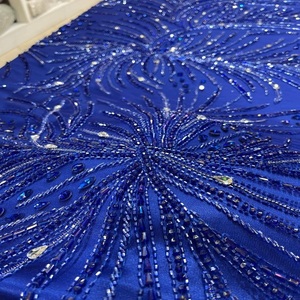 Tissu en tulle et dentelle de créateur avec broderies complexes de perles et de paillettes pour robes de mariée, mode haute couture et vêtements de soirée. - Product Image 1