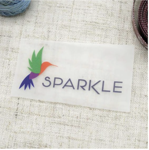 Etiquetas Termoadhesivas Personalizadas para Ropa, Bolsas y Zapatos - Borde Cortado con Láser, Ecológicas, Colores y Tamaños Personalizados, Tipo de Costura - Product Image 1