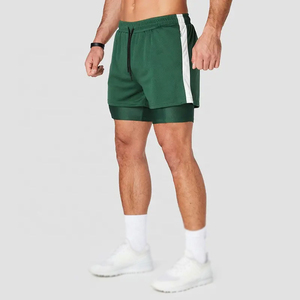 กางเกงขาสั้นกีฬาพรีเมียมสองชั้น ผ้าฝ้ายอ๊อกซ์ฟอร์ดยืดหยุ่น ระบายอากาศ กันน้ำ 100% มีซิปและกระเป๋า  โลโก้สั่งทำได้ - Product Image 1