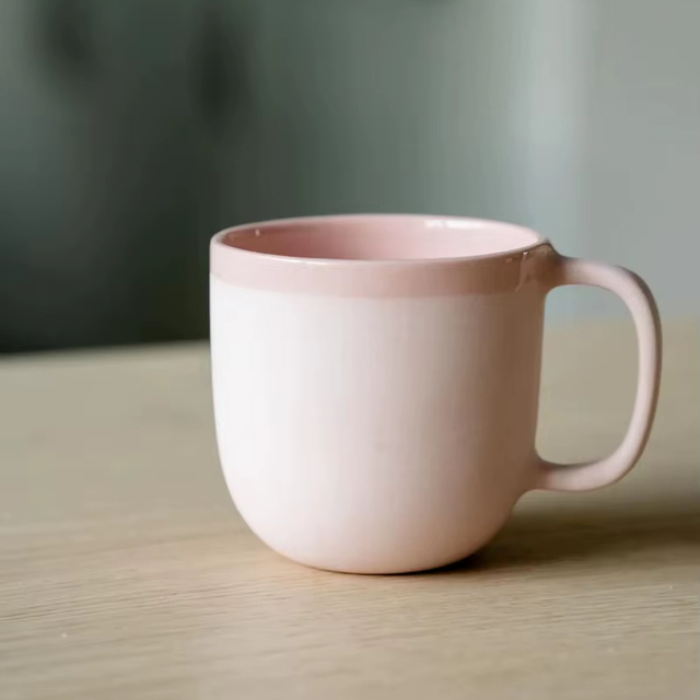 Soft Touch Ceramic Coffee Mug with Blush Pink Glaze Smooth Contour Ergonomic Handle Heat Retention Design for Everyday