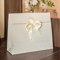 Sac à bijoux en papier artisanal de luxe, écologique et personnalisé, avec logo en ruban et feuille métallisée pour emballage cadeau de boutique et vente au détail