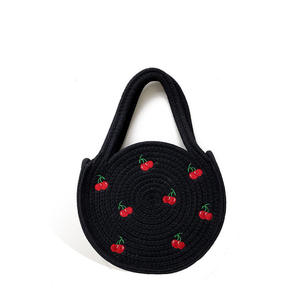 Bring playful charm to your everyday look with this stunning Natural yarn <b>bag</b> featuring <b>sweet</b> cherry embroidery and round handle - Product Image 1