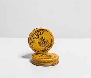 Crema de masaje en bote metálico redondo amarillo para el cuidado diario de la piel - Product Image 1