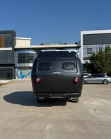 Mini-caravane noire en forme de larme avec salle de bain et cuisine pour le camping et les voyages, disponible à la vente