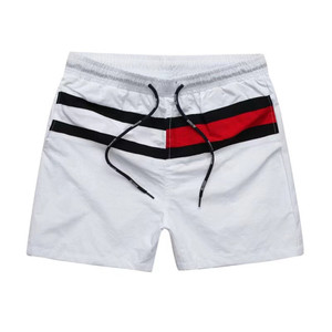 Shorts de bain pour hommes bleus avec bande latérale rouge, blanche et noire, séchage rapide, taille à cordon de serrage, décontractés - Product Image 3