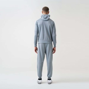 Ensemble de jogging en molleton technique gris pour homme, survêtement haute performance pour l'entraînement physique, les tenues décontractées et les voyages confortables - Product Image 1