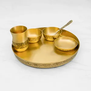 Assiette de cuisine indienne traditionnelle, thali, repas festif, bols ronds en métal, cuillère, verre, culture, célébrations. - Product Image 1