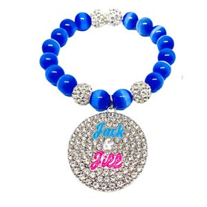 Bracelet extensible bleu roi perlé avec pendentif rond en cristal et accents en strass argentés, accessoire de mode pour femme - Product Image 1