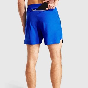Shorts de sport bleus pour hommes à séchage rapide avec poches, taille élastique, longueur mi-cuisse, couleur unie, en polyester tricoté, pour la course et le fitness - Product Image 6