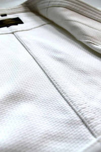 Professional White Karate Gi Set with Premium Quality Material, Reinforced Stitching, and Adjustable Red Belt - Product Image 4