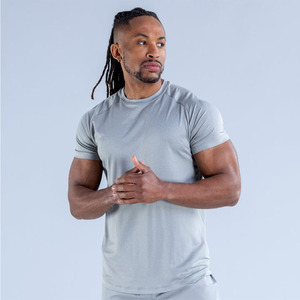 Camisetas de Gimnasio para Hombre con Logotipo Frontal Personalizado al por Mayor, Ropa Deportiva Transpirable de Secado Rápido, Camisetas de Running con Dobladillo Curvo de Alta Elasticidad OEM - Product Image 1