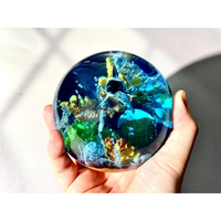 Modelos de bolas de cristal de resina epoxi, modelos de caracoles y edificios, modelos de delfines oceánicos