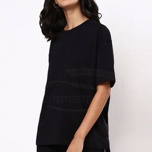 T-shirt pour femme, noir uni, coupe ample, manches courtes, col rond, 100% coton jersey, respirant, style minimaliste, toutes saisons - Product Image 1