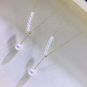 สร้อยคอไข่มุกน้ำจืดธรรมชาติ 7-11 มม. พร้อมจี้ทอง 18K รูปเมล็ดแตงโม ประกายเงางาม 5A และสร้อยคอแบบคล้องไหปลาร้า - Product Image 4