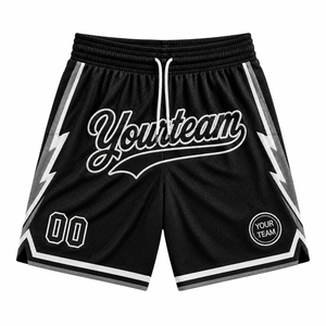 Shorts de basket-ball bleu marine personnalisés avec le logo Yourteam numéro 00 et des accents jaunes en version studio. - Product Image 2