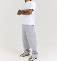 Pantalon de jogging en coton 100% 345 GSM avec logo personnalisé, coupe large élastique, épais, pour homme, décontracté, mi-hauteur, disponible en OEM