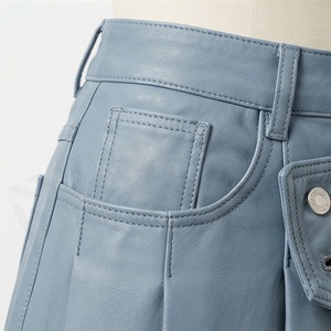 Mini-jupe plissée taille haute en similicuir pour femme, asymétrique, boutonnée, coupe trapèze, unie - Product Image 5