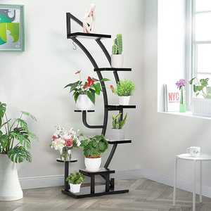 Support à fleurs moderne en métal avec étagères irrégulières pour plantes d'intérieur et présentation décorative - Product Image 1