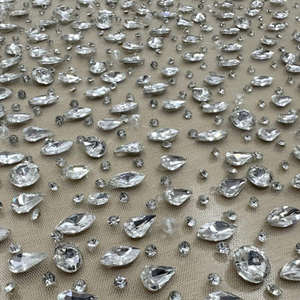 Tissu en dentelle française perlée à la main de qualité supérieure, disponible pour robes de mariée ou robes de soirée, au prix d'usine - Product Image 1