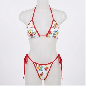 Floral Print 2 Piece Bikini Set With Red Contrast Binding <b>Crossed</b> Halter <b>Top</b> And Tie Side Bottoms Women's Swimwear - Product Image 1
