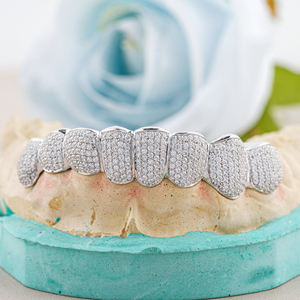Nuevas llegadas: Grillz de Hiphop de lujo, modernos y de alta gama, con incrustaciones de Moissanita de corte brillante redondo, para dientes superiores e inferiores, chapados en oro. - Product Image 1