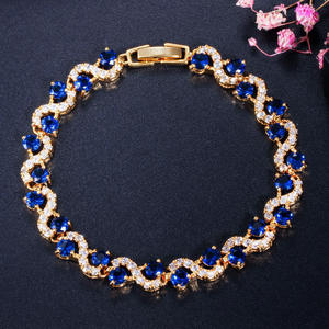 AMBER JEWELS Pulsera de tenis unisex de lujo chapada en oro de 10K con cristales azules y diamantes de imitación, diseño geométrico, engaste de garra, certificado IGI - Product Image 1