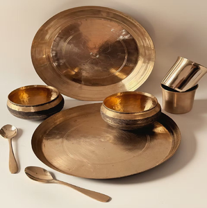 Intricately <b>carved</b> golden Kansa bronze thali <b>set</b> includes multiple katoris <b>and</b> cutlery, available at wholesale prices. - Product Image 6
