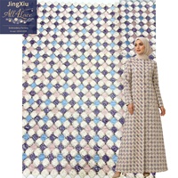 Tela de malla bordada con textura geométrica para la confección de vestidos modestos, abayas, caftanes y prendas de moda.