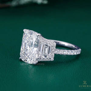 Sophisticated <b>Custom</b> <b>Ring</b> Featuring Cushion Cut Center Diamond with Tapered Baguette and Round Accent Stones VVS2 Clarity - Product Image 1