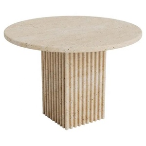 Table basse ronde en travertin avec piédestal cannelé et base sculptée solide, design moderne de luxe pour une décoration intérieure élégante - Product Image 1