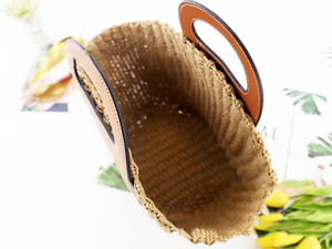 Upgrade your daily accessory collection with this premium Natural yarn bag designed with a large leather patch and <b>top</b> handles - Product Image 2
