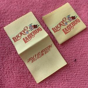 High Density Damask Woven Labels One Side Fold Laser Cut <b>Edge</b> Stitch Brand Logo Garment Labels for Coats Apparel TITAN TREAD - Product Image 1