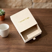 Meilleure Vente OEM ODM Boîte d'emballage rigide style livre pour cils et macarons, avec logo personnalisé, ruban blanc et estampage à chaud
