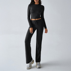Ensemble de vêtements de yoga pour femmes, deux pièces, uni, haut court sans manches, pantalon large à taille haute élastique, respirant, respectueux de l'environnement - Product Image 4