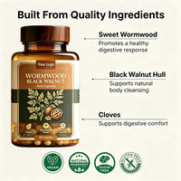 Complément alimentaire OEM en capsules dures à base de poudre naturelle de graines de citrouille et de papaye, d'huile d'origan, d'ail, de noix noires et d'armoise pour la détoxification et le soutien immunitaire