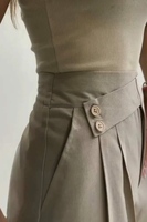 Pantalon tailleur à taille haute et jambes larges pour femme avec plis