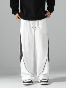 Pantalon de survêtement blanc surdimensionné pour homme, coupe large, avec empiècements latéraux contrastants noirs et détails de passepoil, taille à cordon de serrage – Vente en gros personnalisée - Product Image 4