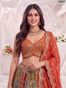 Ensemble de fête prêt-à-porter en soie Gadhwal de luxe, comprenant un Lehenga Choli orange de créateur, un imprimé de qualité supérieure et un travail de miroir et de Dori, avec chemisier cousu. - Product Image 6