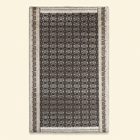 Tapis en laine tufté à la main Midnight Nomad noir ivoire, motif tribal géométrique traditionnel, avec envers antidérapant et écologique