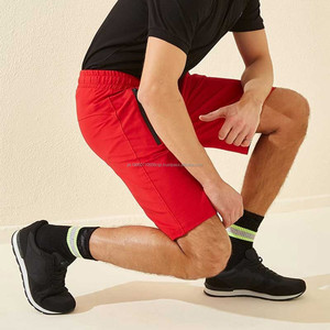 Venta al por mayor logotipo personalizado 100% algodón pantalones cortos a prueba de viento de color sólido cordón sudor cortavientos pantalones cortos de los hombres - Product Image 1