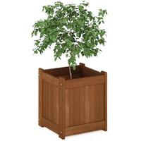 Grand bac à plantes rectangulaire en bois avec feuillage vert dense, jardinière surélevée rustique pour extérieur, aménagement paysager décoratif pour la maison