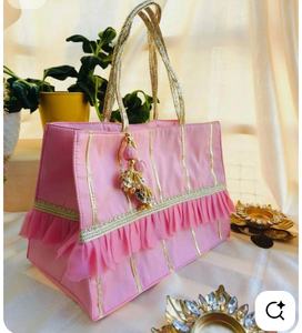 Elegant Blush <b>Pink</b> Handcrafted Potli Handbag with Gold Zari Stripes Ruffled Organza Detail and Decorative Tassel Charm - Product Image 2