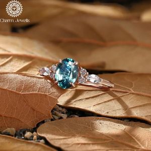 Bague de fiançailles classique pour femme Charm Jewells, en argent plaqué or 18 carats, sertie de trois pierres de moissanite taille coussin, 3 grammes, IGI - Product Image 1