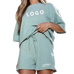 Conjunto de camiseta y pantalones cortos deportivos informales para mujer, colección de verano de media manga con cuello redondo y algodón sólido hasta la rodilla - Product Image 3