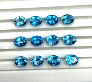 พลอยบลูโทแพซธรรมชาติทรงรีขนาด 6 มม. 9 มม. แบบเจียระไน พลอยบลูโทแพซสีฟ้าสวิสแบบเม็ดเดี่ยว ขนาดปรับเทียบได้ ขายส่งจำนวนมาก - Product Image 1